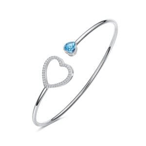 silver heart-shaped bracelet with blue stone