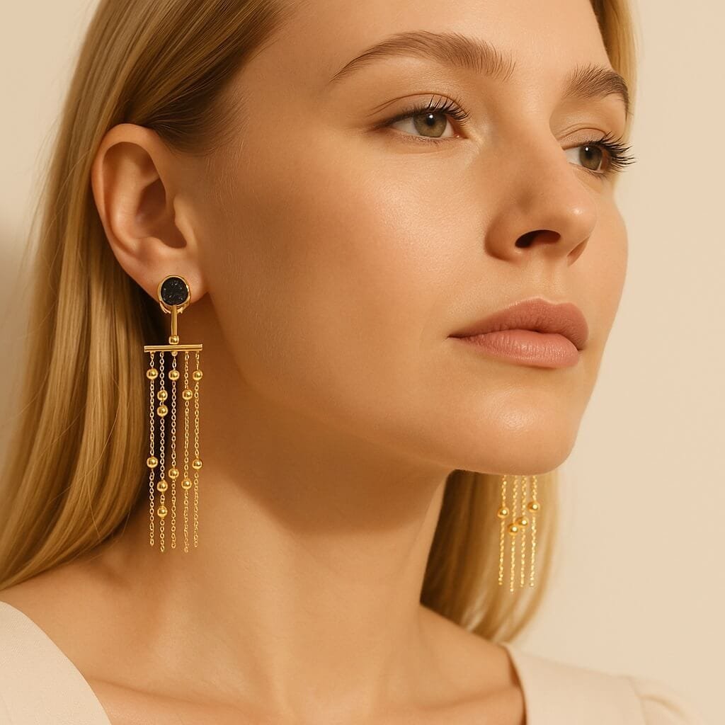 model showcasing gold dangle earrings with black accents